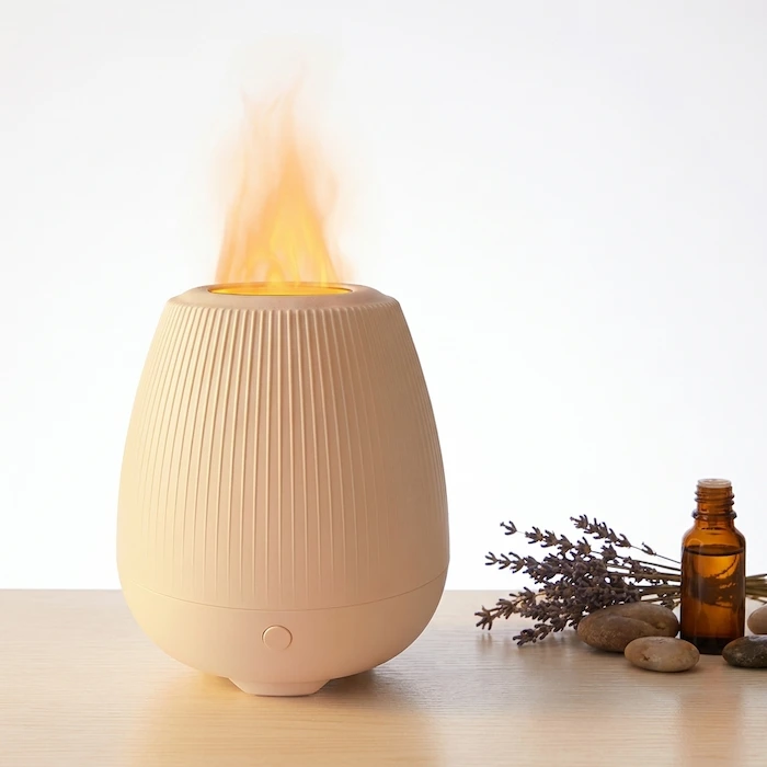 MISTVO Flame Fireplace Diffuser in garden setting